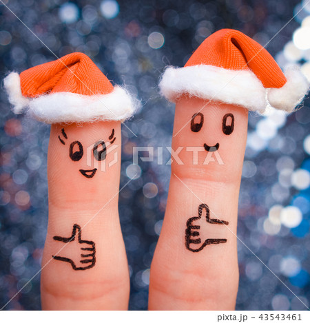 Finger art of couple celebrates Christmas.  43543461