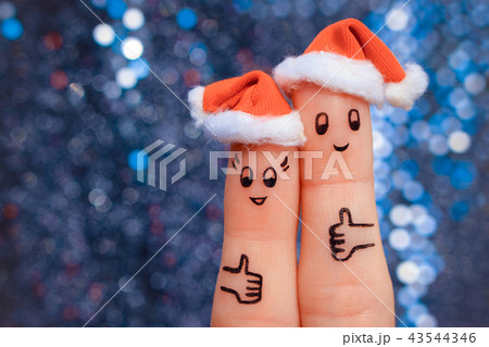 Finger art of couple celebrates Christmas. Finger art of couple celebrates Christmas. 43544346