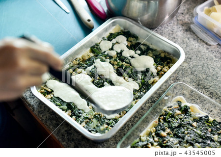 Fried spinach lay on boiled pasta for make lasagna Fried spinach lay on boiled pasta for make lasagna 43545005