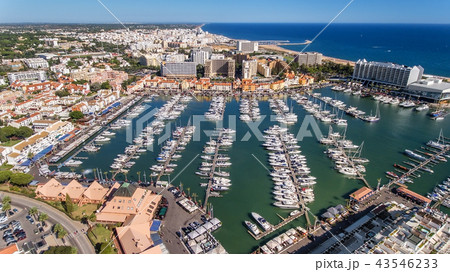 Aerial view of the bay of the marina, with luxury yachts in Vilamoura. Aerial view of the bay of the marina, with luxury yachts in Vilamoura. 43546233