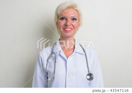 Beautiful happy blonde woman doctor with short hair Beautiful happy blonde woman doctor with short hair 43547116