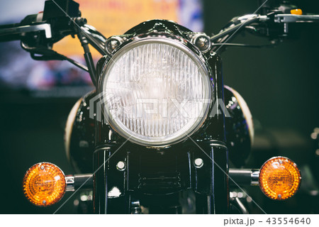 Close-up view of motorcycle headlight. Close-up view of motorcycle headlight. 43554640
