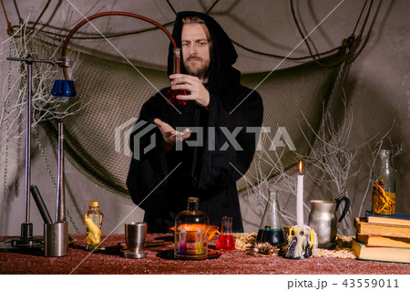 medieval alchemist scientist conducts a ritual  43559011