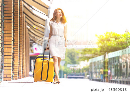 Girl traveler and suitcase Girl traveler and suitcase 43560318