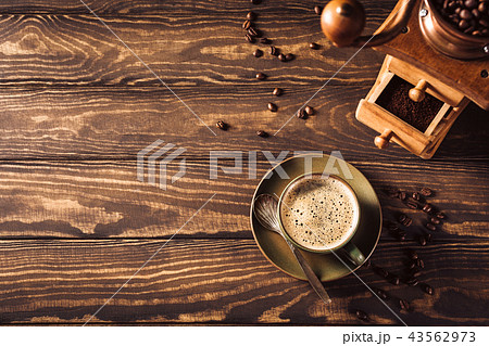 Background with cup of coffee and grinder 43562973