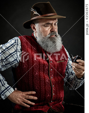 dramatic portrait of senior smoking tobacco pipe dramatic portrait of senior smoking tobacco pipe 43563975