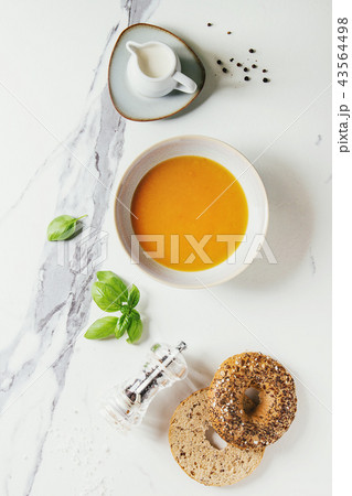 Pumpkin or carrot soup 43564498