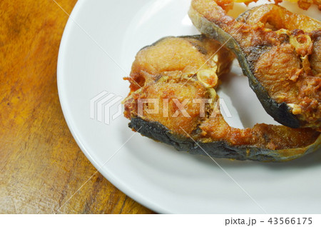 fried salty striped catfish slice on white dish fried salty striped catfish slice on white dish 43566175
