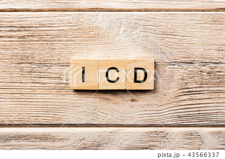 icd word written on wood block. 43566337