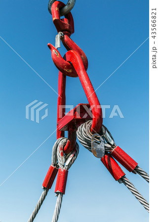 hook of a crane lifts a load   43566821