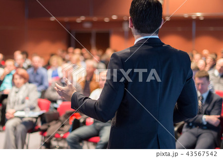Public speaker giving talk at business event. 43567542