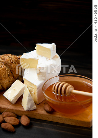slices of cheese brie or camembert with croissants slices of cheese brie or camembert with croissants 43576968