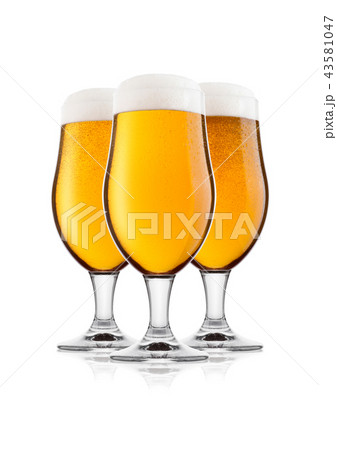 Cold glasses of lager beer with foam and dew 43581047