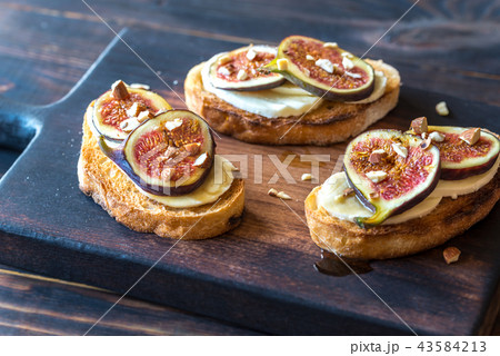 Toasts with cheese and figs Toasts with cheese and figs 43584213
