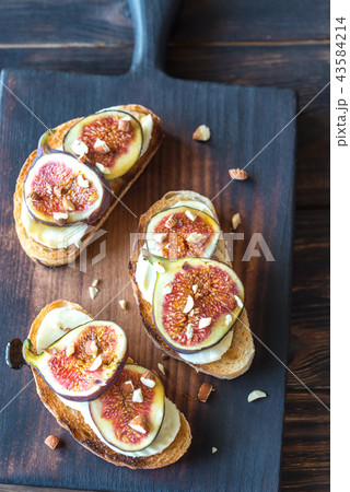 Toasts with cheese and figs Toasts with cheese and figs 43584214