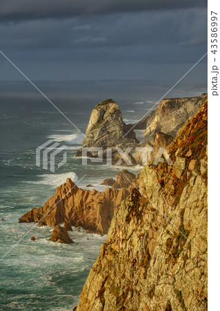 Steep coastline and stormy clouds 43586997