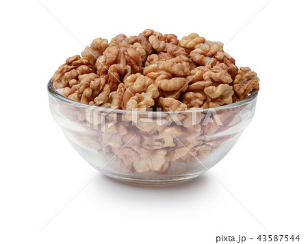 Walnuts in a glass bowl isolated 43587544