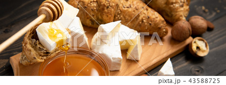 slices of cheese brie or camembert with croissants slices of cheese brie or camembert with croissants 43588725