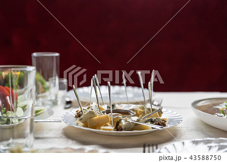 Cheese set with honey and walnuts on festive table 43588750