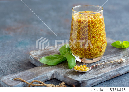 Download Mustard sauce in a glass jar and fresh basil.の写真素材 ... Yellowimages Mockups