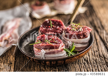 Beef tenderloin steak wrapped in bacon. 43589631