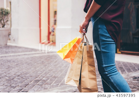 Consumerism, shopping lifestyle concept, Young woman standing an 43597395