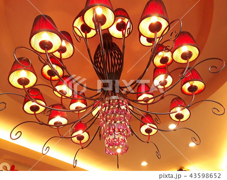 Many lamps hang the ceiling. Many lamps hang the ceiling. 43598652