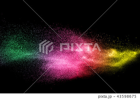 Green pink and yellow dust particles explosion 43598675