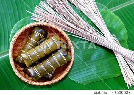 Glutinous rice steamed in banana leaf in bamboo bo Glutinous rice steamed in banana leaf in bamboo bo 43600083