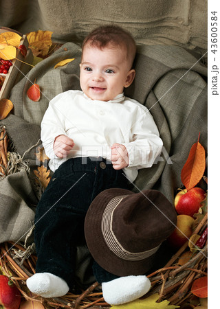 autumn concept - child boy lie on yellow leaves autumn concept - child boy lie on yellow leaves 43600584