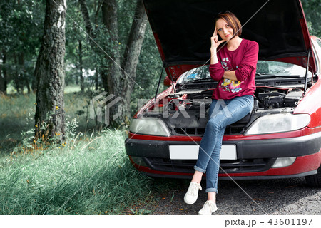 young girl with red car 43601197