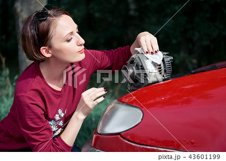 young girl with red car young girl with red car 43601199