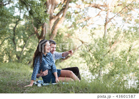 young couple walking in forest, romantic feelings 43601587