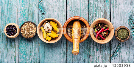 Variety of spices on kitchen table 43603958