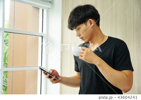 Young asia businessman drink coffee Young asia businessman drink coffee 43604241