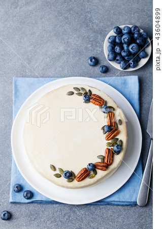 Vegan, raw carrot cake. Healthy food. Grey stone background. Top view. Copy space. 43604899