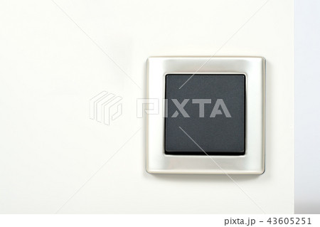 light switch with silver frame on the wall light switch with silver frame on the wall 43605251