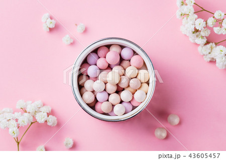 Pearl make up powder on pink pastel background. Top view. 43605457