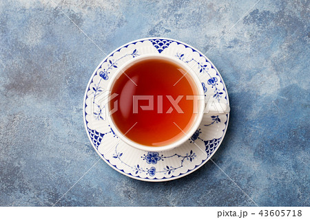 Cup of tea on a blue stone background. Copy space. Top view. 43605718