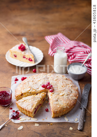Almond and raspberry cake, Bakewell tart. Traditional British pastry. Wooden background. Copy space. 43605818
