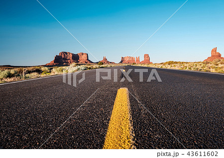 Empty scenic highway in Monument Valley 43611602