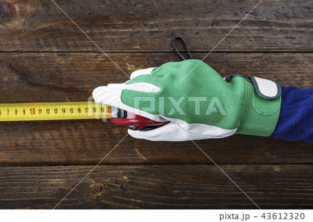 in hand in working glove meter in hand in working glove meter 43612320