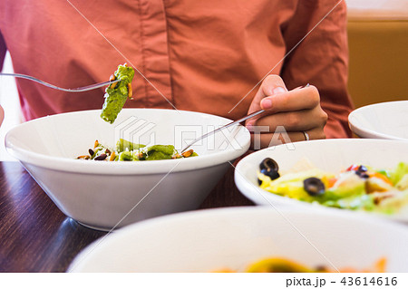Female eating pasta in the restaurant Female eating pasta in the restaurant 43614616