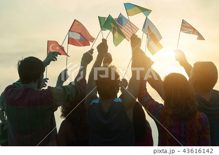 Crowd of people rising up country flags. Crowd of people rising up country flags. 43616142