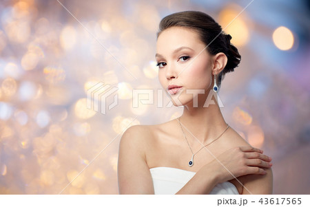 beautiful asian woman with earring and pendant beautiful asian woman with earring and pendant 43617565