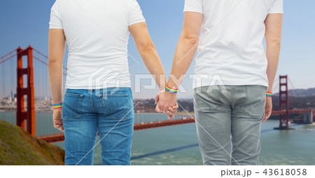 male couple with gay pride rainbow wristbands 43618058