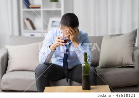 alcoholic drinking red wine at home alcoholic drinking red wine at home 43618121