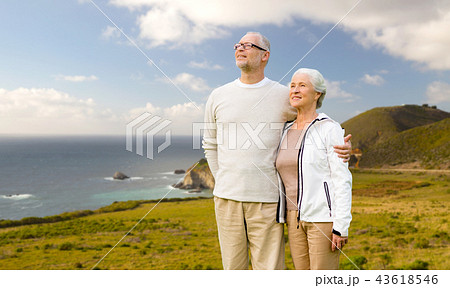 happy senior couple hugging over big sur coast 43618546