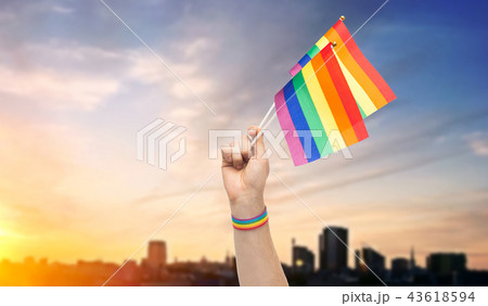 hand with gay pride rainbow flags and wristband 43618594
