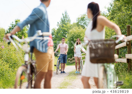 happy friends with fixed gear bicycles in summer 43619819